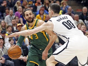 Brooklyn Nets forward Rodions Kurucs (00) defends against Utah Jazz guard Ricky Rubio (3) during the first half of an NBA basketball game Saturday, March 16, 2019, in Salt Lake City.