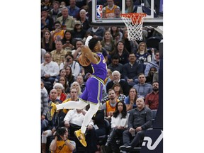 Utah Jazz guard Donovan Mitchell dunks against the Washington Wizards during the first half of an NBA basketball game Friday, March 29, 2019, in Salt Lake City.