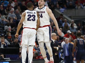 Gonzaga's Corey Kispert (24) celebrates with Zach Norvell Jr. (23) after scoring against Fairleigh Dickinson during the first half of a first-round game in the NCAA men's college basketball tournament Thursday, March 21, 2019, in Salt Lake City.