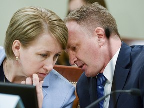 Rep. Craig Hall, R-West Valley City confers with Judiciary chair Rep. Karianne Lisonbee, during the House Judiciary Committee meeting in Salt Lake City, Utah, on Tuesday, March 5, 2019. Hall watched lawmakers dismantle his bill to end conversion therapy and replace it with an alternative that he says would do nothing to stop the widely-discredited practice.