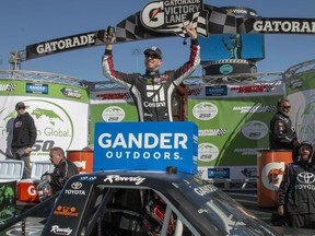 Kyle Busch celebrates career win 201 following the NASCAR Gander Outdoors Truck Series race at Martinsville Speedway in Martinsville, Va. Saturday, March 23.