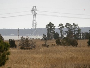 Dominion Energy Virginia's new Skiffes Creek transmission line is seen from Hog Island Wildlife Management Area Wednesday, Feb. 27, 2019.