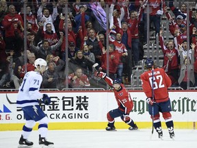 Washington Capitals center Lars Eller (20), of Denmark, celebrates his goal with left wing Carl Hagelin (62) as Tampa Bay Lightning center Anthony Cirelli (71) skates by during the first period of an NHL hockey game Wednesday, March 20, 2019, in Washington.