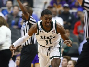 Michigan State forward Aaron Henry gestures after making a 3-pointer against LSU during the first half of an East Regional semifinal in the NCAA men's college basketball tournament in Washington, Friday, March 29, 2019.