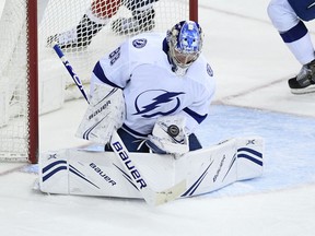 Tampa Bay Lightning goaltender Andrei Vasilevskiy, of Russia, stops the puck during the third period of the team's NHL hockey game against the Washington Capitals, Wednesday, March 20, 2019, in Washington. The Lightning won 5-4 in overtime.