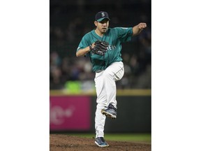 Seattle Mariners starter Yusei Kikuchi watches a pitch during the fifth inning of the team's baseball game against the Boston Red Sox, Friday, March 29, 2019, in Seattle.