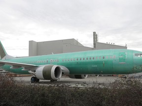 A Boeing 737 MAX 8 being built for Oman Air sits parked at Boeing Co.'s Renton Assembly Plant, Monday, March 11, 2019, in Renton, Wash. Airlines in several countries grounded the same model jetliner Monday following Sunday's crash of an Ethiopian Airlines Boeing 737 Max 8, the second devastating crash of one of the planes in five months.
