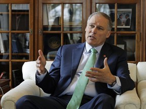 In this Jan. 24, 2019 file photo, Washington Gov. Jay Inslee takes part in an AP interview, at the Capitol in Olympia, Wash. On March 1, 2019, Inslee announced that he will seek the 2020 Democratic presidential nomination with a call for making the fight against climate change the "first, foremost and paramount duty" of the United States.