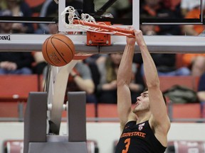 Oregon State forward Tres Tinkle (3) dunks during the first half of an NCAA college basketball game against Washington State in Pullman, Wash., Saturday, March 9, 2019.