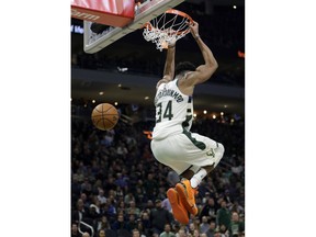 Milwaukee Bucks' Giannis Antetokounmpo dunks during the second half of an NBA basketball game against the Los Angeles Clippers, Thursday, March 28, 2019, in Milwaukee.