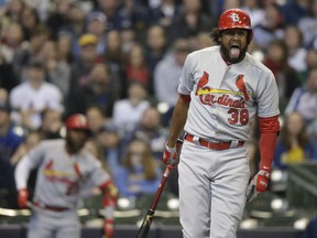 St. Louis Cardinals' Jose Martinez reacts after hitting a foul ball against the Milwaukee Brewers during the first inning of a baseball game Sunday, March 31, 2019, in Milwaukee.