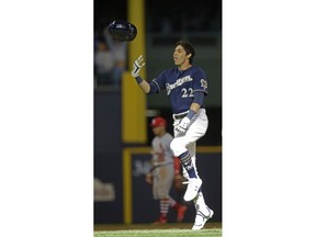 Milwaukee Brewers' Christian Yelich reacts after his game-winning double off the St. Louis Cardinals during the ninth inning of a baseball game Sunday, March 31, 2019, in Milwaukee.