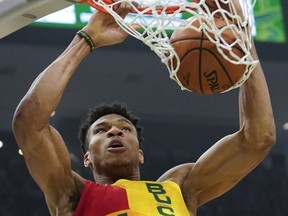 Milwaukee Bucks' Giannis Antetokounmpo dunks during the first half of an NBA basketball game against the Cleveland Cavaliers Sunday, March 24, 2019, in Milwaukee.