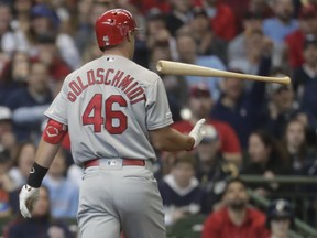 St. Louis Cardinals' Paul Goldschmidt flips his bat after striking out during the first inning of an Opening Day baseball game against the Milwaukee Brewers Thursday, March 28, 2019, in Milwaukee.