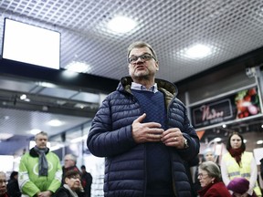 Juha Sipil', former Prime Minister, Chairman of the Center Party, meets citizens after his government resigned, during election campaigning in H'meenlinna, Finland, on Friday March 8, 2019. The Sipil' government resigned Friday over the failure of its flagship social care reforms..