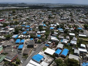 This June 18, 2018, file photo shows an aerial view of the Amelia neighborhood in the municipality of Catano, east of San Juan, Puerto Rico. A long-delayed disaster aid bill that's a top political priority for some of President Donald Trump's GOP allies is facing a potentially tricky path as it heads to the Senate floor this week. Although the measure has wide backing from both parties, the White House isn't pleased with the bill and is particularly opposed to efforts by Democrats to make hurricane relief to Puerto Rico more generous.