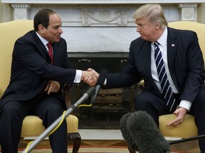 FILE - In this April 3, 2017 file photo, President Donald Trump shakes hands with Egyptian President Abdel Fattah el-Sisi in the Oval Office of the White House in Washington. Trump will meet with El-Sissi next month at the White House.