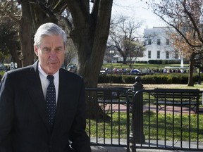 In this March 24, 2019 photo, Special Counsel Robert Mueller walks past the White House, after attending St. John's Episcopal Church for morning services, in Washington.