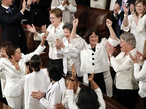 FILE - In this Feb. 5, 2019 file photo, women members of Congress cheer after President Donald Trump acknowledges more women in Congress during his State of the Union address to a joint session of Congress on Capitol Hill in Washington. A new survey finds acceptance of women in American politics and the workforce is at a record high.
