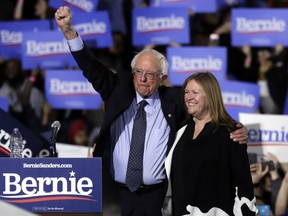 FILE - In this March 3, 2019, file photo, Sen. Bernie Sanders, I-Vt., left, and his wife, Jane O'Meara Sanders, greet supporters as they leave after his 2020 presidential campaign stop at Navy Pier in Chicago. Sanders is raising the stakes of the "Medicare-for-all" debate by expanding his proposal to include long-term care.