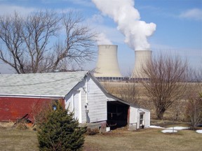 FILE - In this March 16, 2011, file photo, steam escapes from Exelon Corp.'s nuclear plant in Byron, Ill. The nuclear power industry is pushing the Nuclear Regulatory Commission to cut back on inspections at nuclear power plants and throttle back what it tells the public about plant problems.