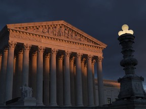 FILE - In this Jan. 24, 2019, file photo, the Supreme Court is seen at sunset in Washington. A long-delayed disaster aid bill that's a top political priority for some of President Donald Trump's GOP allies is facing a potentially tricky path as it heads to the Senate floor this week. Although the measure has wide backing from both parties, the White House isn't pleased with the bill and is particularly opposed to efforts by Democrats to make hurricane relief to Puerto Rico more generous.