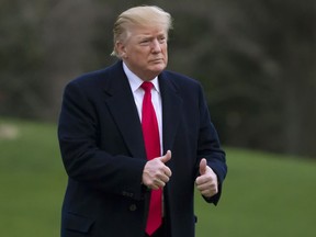 IN this March 24, 2019, photo, President Donald Trump gives two thumbs up after stepping off Marine One on the South Lawn of the White House in Washington. Trump once compared Hillary Clinton's campaign to the lumbering federal bureaucracy, but now he's building one of his own. Trump may still consider himself his own best strategist and communicator, but this time he's leaving nothing to chance. Says Trump campaign manager Brad Parscale: "We are creating the largest and most efficient campaign operation in American history with the ability to reach more voters than ever before."