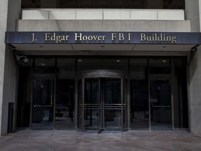 The J. Edgar Hoover FBI Building on Monday, March 4, 2019, in Washington. The FBI is stepping up its efforts to root out foreign corruption with a new squad of agents in Florida. The Miami-based squad begins later this month as part of the bureau's international corruption unit.