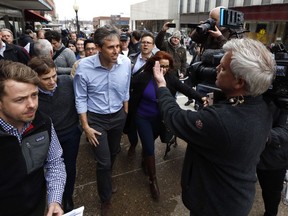 In this March 14, 2019, photo, former Texas congressman Beto O'Rourke speaks to reporters after a meet and greet at the Beancounter Coffeehouse & Drinkery in Burlington, Iowa. The contours of the Democratic presidential primary came into clearer focus this week with O'Rourke's entry into the race.