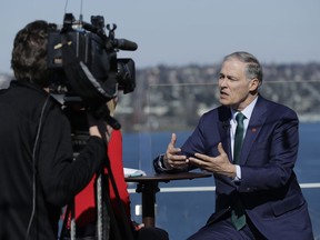 In this March 1, 2019, photo, Washington Gov. Jay Inslee takes part in an interview on an outdoor patio in Seattle. Democrats' growing presidential primary has expanded beyond Capitol Hill and the diverse, women-dominated group of senators that have dominated the race so far. Inslee on Friday became the first governor in the race, and he declared climate change his top priority.