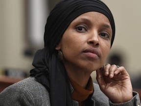 In this March 12, 2019, photo, Rep. Ilhan Omar, D-Minn., listens as Office of Management and Budget Acting Director Russ Vought testifies before the House Budget Committee on Capitol Hill in Washington. Debate in Congress over Israel and anti-Semitism is providing President Donald Trump an opening to appeal to Jewish American voters