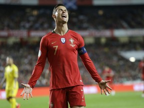 Portugal's Cristiano Ronaldo reacts after missing a scoring chance during the Euro 2020 group B qualifying soccer match between Portugal and Ukraine at the Luz stadium in Lisbon, Friday, March 22, 2019.