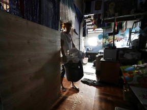 A woman prepares to wash laundry which has piled up after several days without water at her home in Mandaluyong, metropolitan Manila, Philippines on Thursday, March 14, 2019. Aside from the daily line of residents waiting for water rations from trucks, many businesses like laundry shops, carwash and water-purifying stations in Manila have been affected by a water shortage from the Manila Water Company due to low levels at the La Mesa dam and the onset of El Nino which causes below normal rainfall conditions.