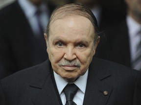 FILE - In this Nov. 21 2011 file photo, Algerian President Abdelaziz Bouteflika waits for Rachid Ghannouchi, head of the Tunisian party Ennahdha, in Algiers. Algeria's longtime leader Abdelaziz Bouteflika has been known as a wily political survivor ever since he fought for independence from France in the 1960s, and now he needs to overcome mass protests against his rule.