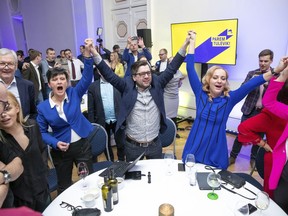 Supporters of the Reform Party react at their headquarters after parliamentary elections in Tallinn, Estonia, early Monday, March 4, 2019. The rival Reform and Center parties, the two main political groupings since Estonia regained independence amid the collapse of the Soviet Union in 1991, shared an election goal of keeping EKRE from making inroads.
