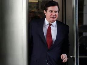 FILE - In this file photo taken on Monday, Nov. 6, 2017, Paul Manafort, President Donald Trump's former campaign chairman, leaves the federal courthouse in Washington.  Russian state television stations have jumped at what they perceive as a relatively mild sentence handed to former Trump campaign chairman Paul Manafort, saying it is proof that U.S. special counsel Robert Mueller's investigations have failed to prove Trump's collusion with Russia.