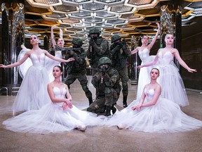 In this undated photo provided by Russian Defense Ministry Press Service, soldiers and ballerinas pose for pictures during a photoshoot in Yekaterinburg, Russia, to mark International Women's Day. When a Russian army recruitment office ordered a photoshoot to celebrate International Women's Day, it didn't feature any of the 45,000 women currently serving in the country's armed forces. While International Women's Day is marked Friday across many countries with calls for gender equality, in Russia it is still a holiday largely focused on celebrating outdated gender roles. (Russian Defense Ministry Press Service via AP)