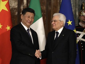 Chinese President Xi Jinping, left, shakes hands with Italian President Sergio Mattarella at the Quirinale Presidential Palace, in Rome, Friday, March 22, 2019. Jinping is launching a two-day official visit aimed at deepening economic and cultural ties with Italy through an ambitious infrastructure building program called "Belt and Road" that has raised suspicions among Italy's U.S. and European allies.