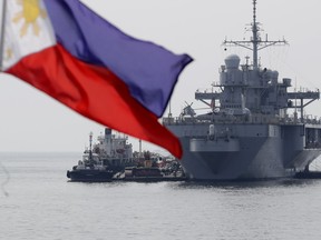 The USS Blue Ridge (LCC-19), the U.S. 7th Fleet Flagship, is anchored off Manila Bay west of Manila, Philippines for a routine port call Wednesday, March 13, 2019. Capt. Eric Anduze, Commander of the USS Blue Ridge, renewed an American vow to "sail, fly and operate wherever the law allows us to" amid China's objection to U.S. military presence in the disputed South China Sea.