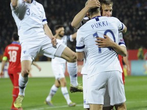 Finland's players celebrate their side's opening goal scored by Fredrik Jensen during the Euro 2020 group J qualifying soccer match between Armenia and Finland at the Vazgen Sargsyan Republican stadium in Yerevan, Armenia, Tuesday, March 26, 2019.