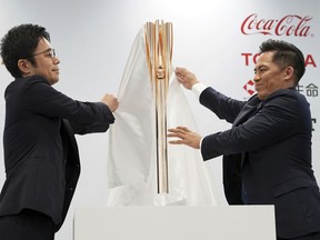 The Olympic torch of the Tokyo 2020 Olympic Games is unveiled during a press conference in Tokyo Wednesday, March 20, 2019. The torch is the centerpiece of attention in the months just before the Olympics open. The Tokyo Olympics open on July 24, 2020.