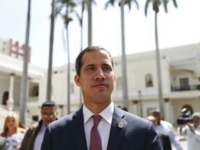 Venezuelan opposition leader Juan Guaido, who has declared himself interim president, arrives to the National Assembly for a meeting with "Frente Amplio," a coalition of opposition parties, and other civic groups in Caracas, Venezuela, Monday, March 18, 2019. President Nicolas Maduro has remained in power despite heavy pressure from the United States and other countries arrayed against him, managing to retain the loyalty of most of Venezuela's military leaders.