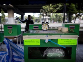 An officer sets up a polling station where Thailand's Prime Minister Prayuth Chan-ocha is scheduled to cast his vote in Bangkok, Thailand, Sunday, March 24, 2019. Thailand's first general election since the military seized power in a 2014 coup is scheduled to be held on Sunday.