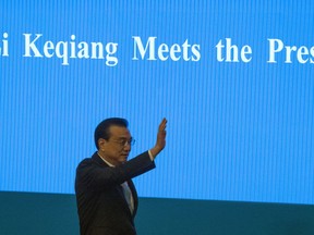 Chinese Premier Li Keqiang arrives for a press conference after the closing session of the National People's Congress in Beijing's Great Hall of the People on Friday, March 15, 2019.