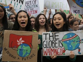 Hundreds of schoolchildren take part in a climate protest in Hong Kong, Friday, March 15, 2019. Students in more than 80 countries and territories worldwide plan to skip class Friday in protest over their governments' failure to act against global warming. The coordinated 'school strike' was inspired by 16-year-old activist Greta Thunberg, who began holding solitary demonstrations outside the Swedish parliament last year.