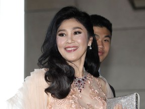 Former Thai Prime Minister Yingluck Shinawatra arrives at the wedding of her niece Paetongtarn "Ing" Shinawatra at a hotel in Hong Kong, Friday, March 22, 2019.