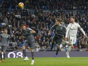 Real Madrid's Sergio Ramos sheds the ball during a Spanish La Liga soccer match between Real Madrid and Celta at the Santiago Bernabeu stadium in Madrid, Spain, Saturday, March 16, 2019.