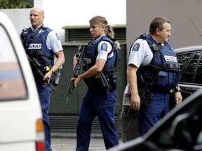 Armed police patrol outside a mosque in central Christchurch, New Zealand, Friday, March 15, 2019. A witness says many people have been killed in a mass shooting at a mosque in the New Zealand city of Christchurch.