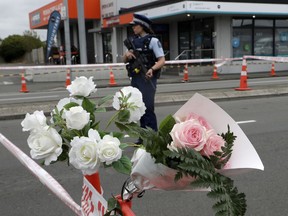A police officer stands at a police cordon at an intersection near the Linwood Mosque in Christchurch, New Zealand, Sunday, March 17, 2019. The live-streamed attack by an immigrant-hating white nationalist killed dozens of people as they gathered for weekly prayers in Christchurch on Friday, March 17.