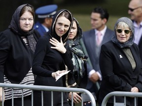New Zealand Prime Minister Jacinda Ardern, center, leaves Friday prayers at Hagley Park in Christchurch, New Zealand, Friday, March 22, 2019. People across New Zealand are observing the Muslim call to prayer as the nation reflects on the moment one week ago when 50 people were slaughtered at two mosques.